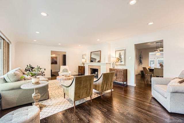 3695 E Dartmouth Ave, Denver, CO 80210 - living area with dark wood finished floors, recessed lighting, and a fireplace
