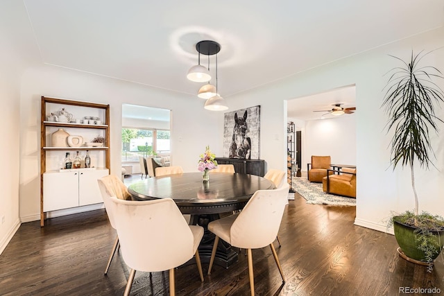 3695 E Dartmouth Ave, Denver, CO 80210 - dining area featuring dark wood finished floors and baseboards