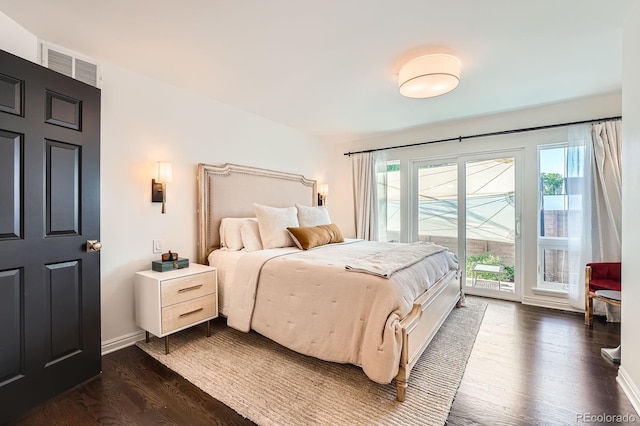 3695 E Dartmouth Ave, Denver, CO 80210 - bedroom featuring access to exterior and dark wood-type flooring