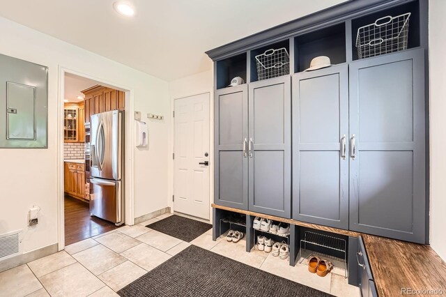3695 E Dartmouth Ave, Denver, CO 80210 - mudroom with electric panel, light tile patterned floors, and recessed lighting