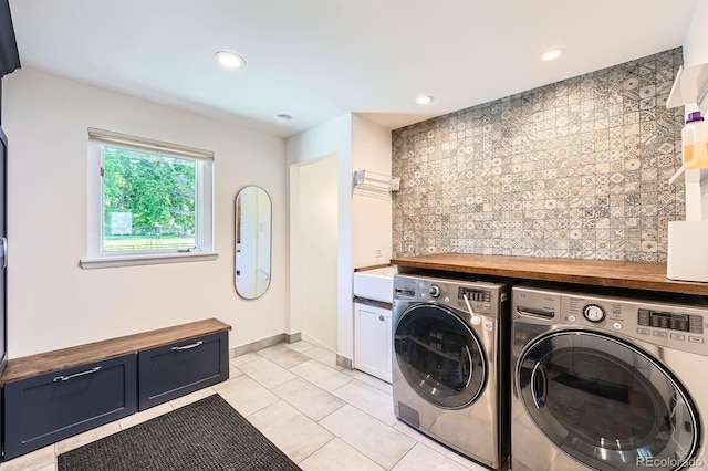 3695 E Dartmouth Ave, Denver, CO 80210 - washroom with independent washer and dryer, light tile patterned flooring, cabinet space, and recessed lighting