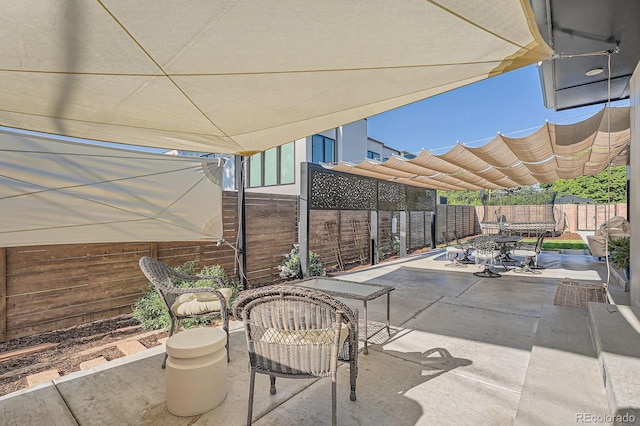 3695 E Dartmouth Ave, Denver, CO 80210 - fenced backyard featuring outdoor dining area and a patio