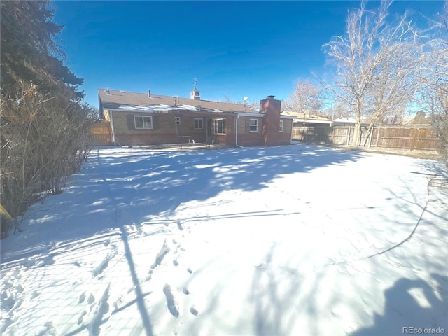 view of snow covered property