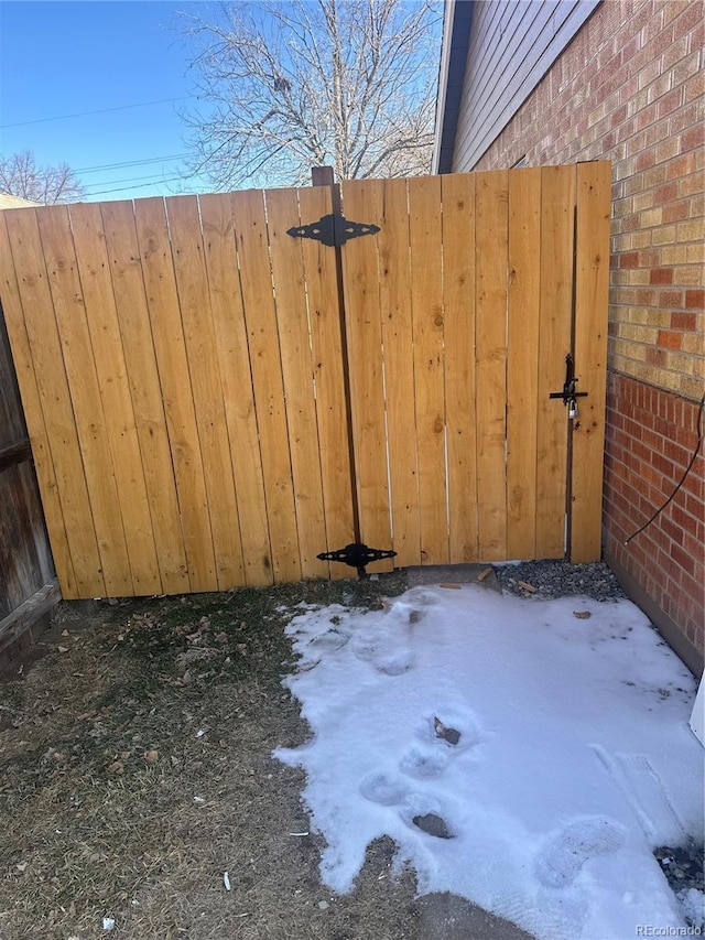 view of snow covered gate