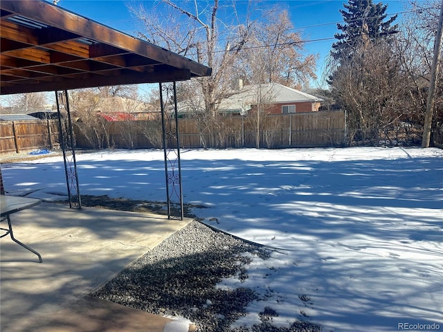 view of yard layered in snow