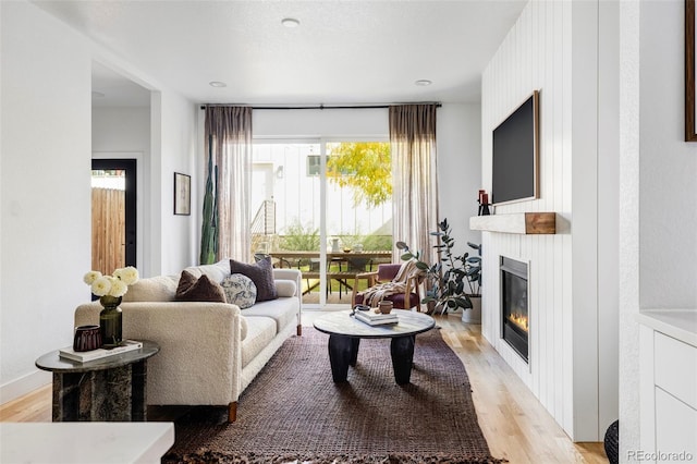 living room with plenty of natural light and light wood-type flooring