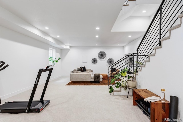 exercise area featuring light carpet