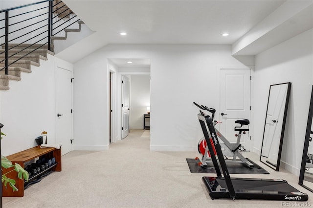 workout area featuring light colored carpet