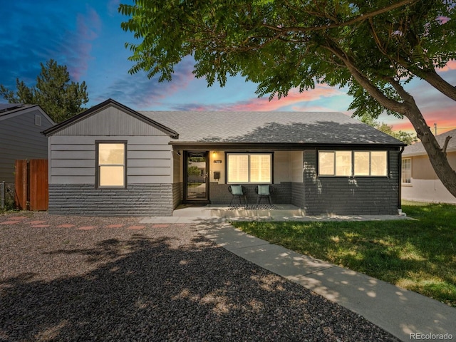 1785 Geneva St, Aurora, CO 80010 - ranch-style home featuring brick siding and a shingled roof