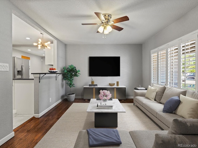 1785 Geneva St, Aurora, CO 80010 - living area with wood finished floors, ceiling fan, and recessed lighting