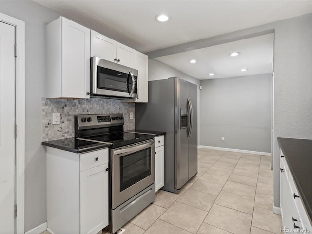 1785 Geneva St, Aurora, CO 80010 - kitchen with stainless steel appliances, dark countertops, tasteful backsplash, recessed lighting, and white cabinetry