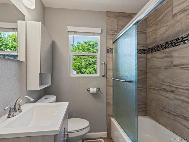 1785 Geneva St, Aurora, CO 80010 - full bath with vanity and enclosed tub / shower combo