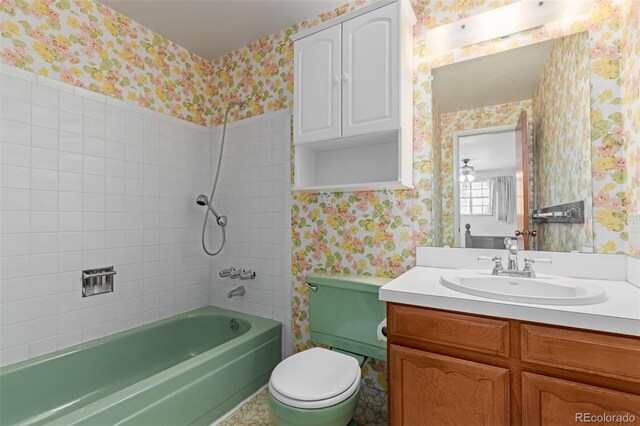 519 N Columbine St, Golden, CO 80403 - bathroom featuring wallpapered walls, vanity, and tub / shower combination