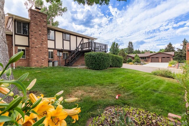 519 N Columbine St, Golden, CO 80403 - view of grassy yard with stairs and a wooden deck