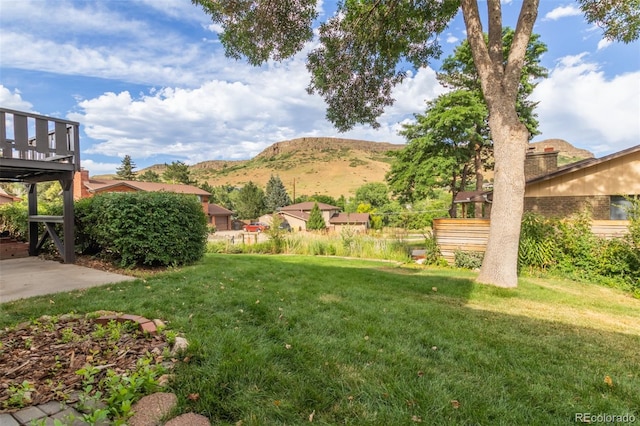 519 N Columbine St, Golden, CO 80403 - view of grassy yard with a deck with mountain view
