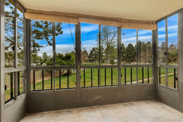 13952 E Marina Dr Unit 102, Aurora, CO 80014 - unfurnished sunroom with a textured ceiling