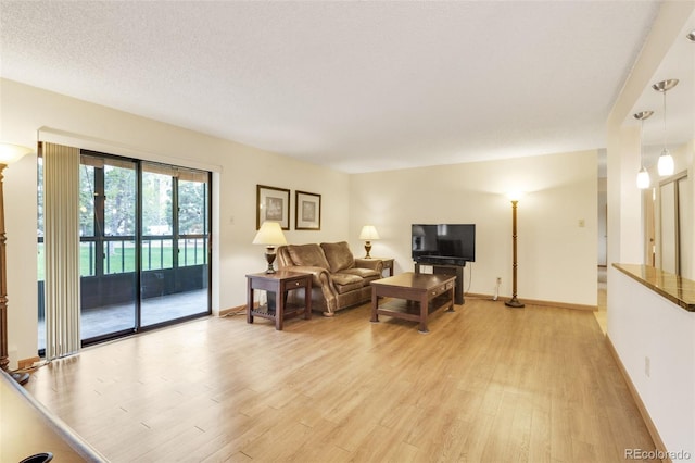 13952 E Marina Dr Unit 102, Aurora, CO 80014 - living room with light wood finished floors and baseboards