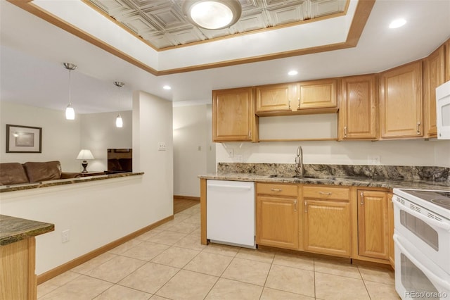 13952 E Marina Dr Unit 102, Aurora, CO 80014 - kitchen featuring white appliances, a tray ceiling, recessed lighting, decorative light fixtures, and dark stone counters