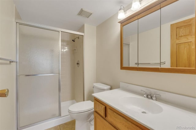 13952 E Marina Dr Unit 102, Aurora, CO 80014 - full bathroom featuring a stall shower, vanity, and tile patterned flooring
