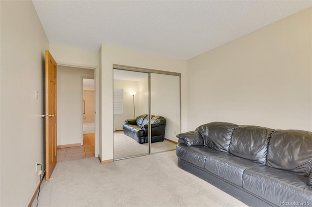 13952 E Marina Dr Unit 102, Aurora, CO 80014 - living room featuring light colored carpet and baseboards