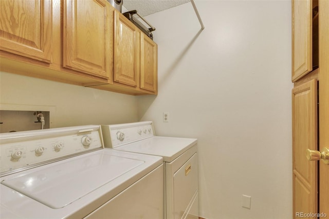 13952 E Marina Dr Unit 102, Aurora, CO 80014 - laundry area featuring cabinet space and washing machine and clothes dryer
