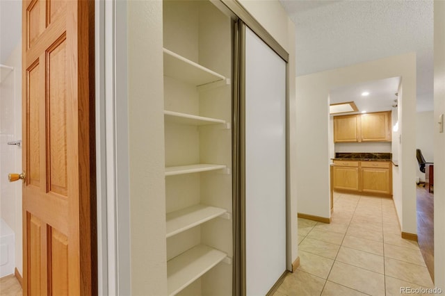 13952 E Marina Dr Unit 102, Aurora, CO 80014 - hallway featuring light tile patterned flooring and recessed lighting