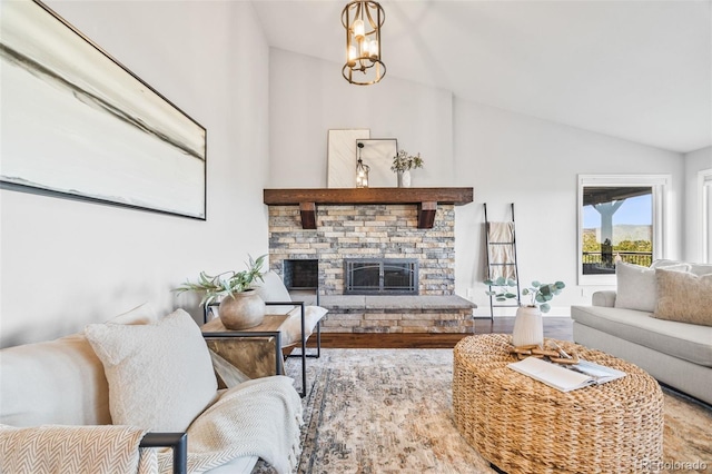 2357 Oak Ridge Rd, Sedalia, CO 80135 - living area featuring vaulted ceiling, a fireplace, and wood finished floors