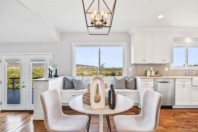 2357 Oak Ridge Rd, Sedalia, CO 80135 - dining room featuring a chandelier, recessed lighting, dark wood-style flooring, and french doors