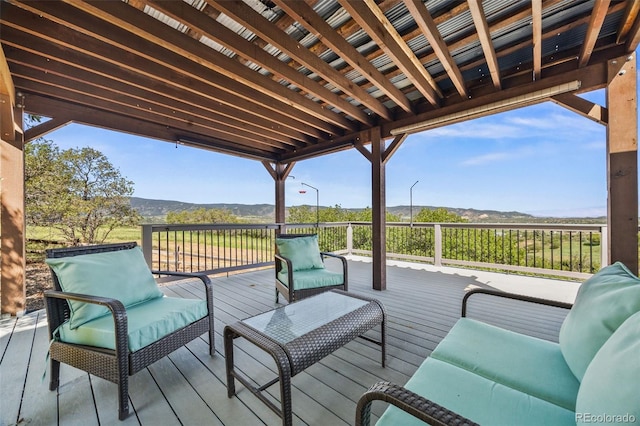 2357 Oak Ridge Rd, Sedalia, CO 80135 - deck featuring a mountain view and outdoor lounge area