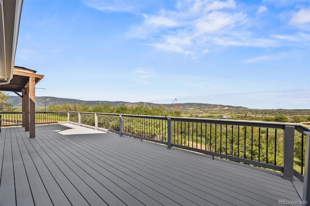 2357 Oak Ridge Rd, Sedalia, CO 80135 - wooden deck featuring a mountain view