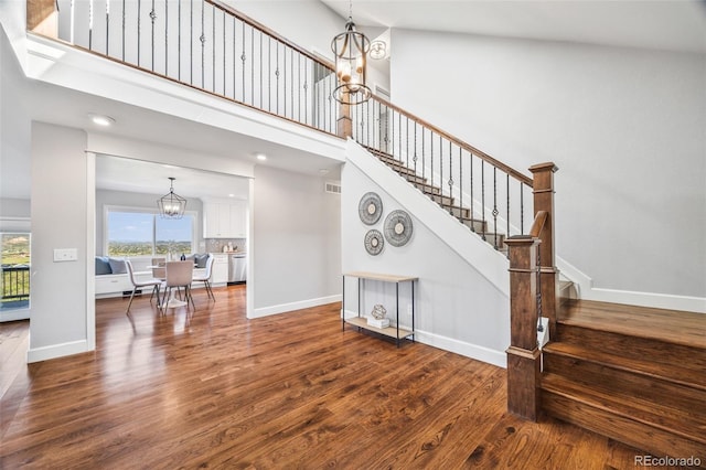 2357 Oak Ridge Rd, Sedalia, CO 80135 - staircase with a chandelier, wood finished floors, and plenty of natural light