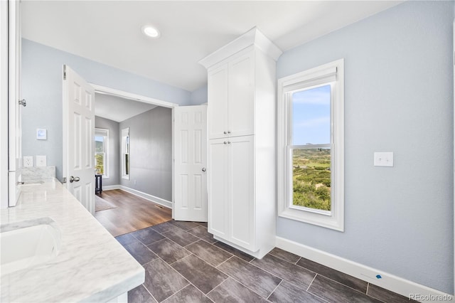2357 Oak Ridge Rd, Sedalia, CO 80135 - bathroom featuring healthy amount of natural light, double vanity, and recessed lighting