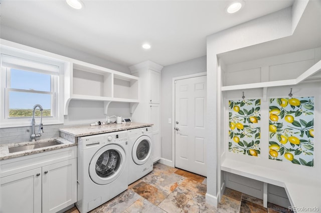 2357 Oak Ridge Rd, Sedalia, CO 80135 - laundry room with separate washer and dryer, stone tile flooring, cabinet space, and recessed lighting