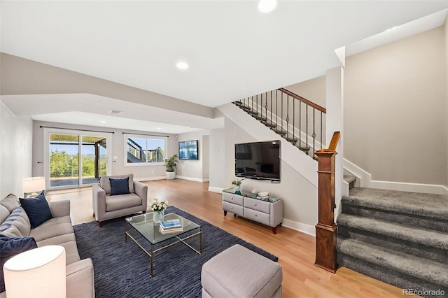 2357 Oak Ridge Rd, Sedalia, CO 80135 - living room with wood finished floors, stairway, and recessed lighting