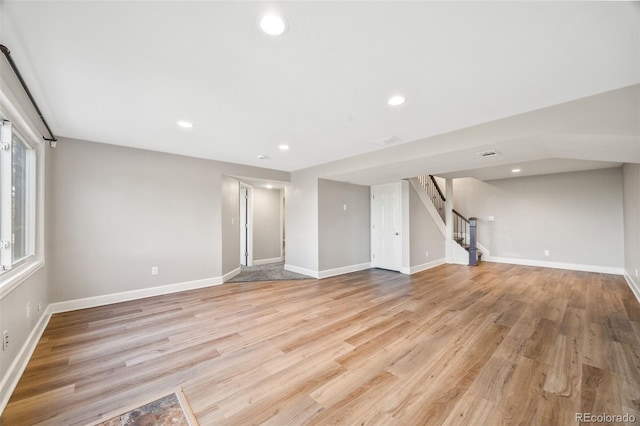 2357 Oak Ridge Rd, Sedalia, CO 80135 - unfurnished living room featuring stairs, recessed lighting, and light wood-type flooring