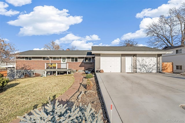 single story home featuring brick siding, concrete driveway, an attached garage, fence, and a front lawn