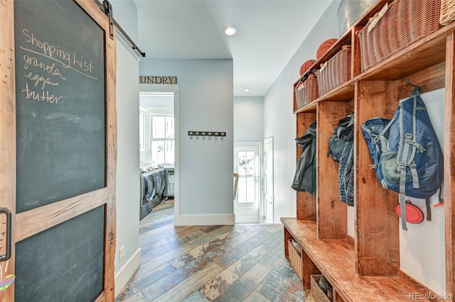 mudroom featuring washer and dryer and a barn door