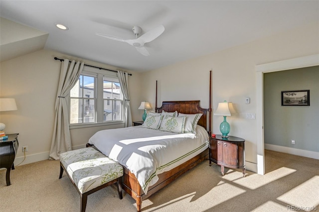 carpeted bedroom with vaulted ceiling and ceiling fan