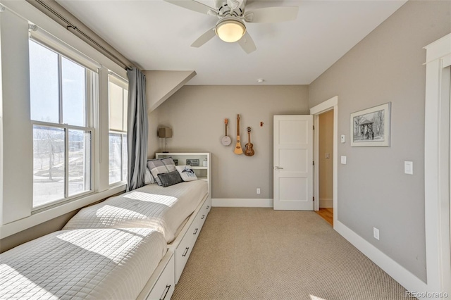 bedroom with ceiling fan and light colored carpet