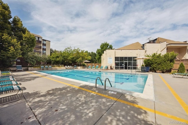 view of swimming pool featuring a patio area