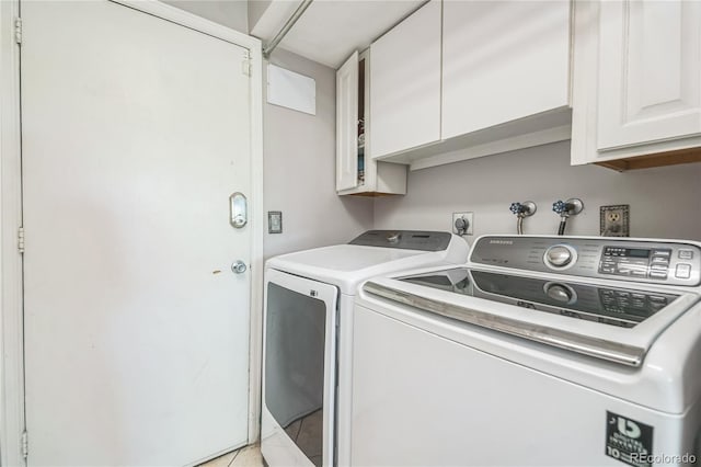 8150 W Calhoun Dr, Littleton, CO 80123 - laundry area featuring cabinet space, independent washer and dryer, and light tile patterned floors