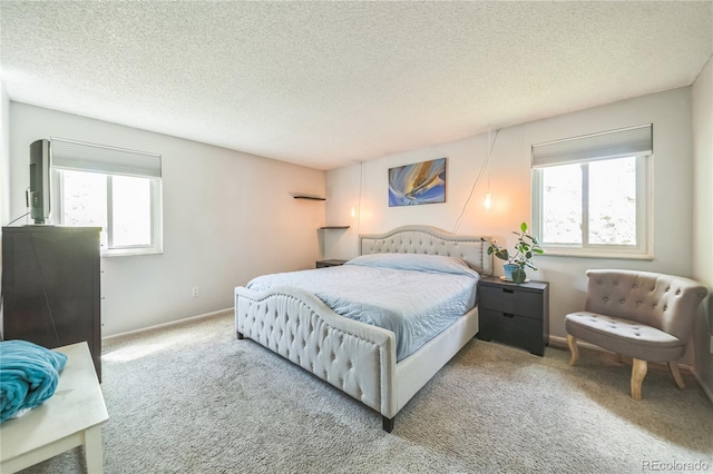 8150 W Calhoun Dr, Littleton, CO 80123 - bedroom with multiple windows, carpet, a textured ceiling, and baseboards