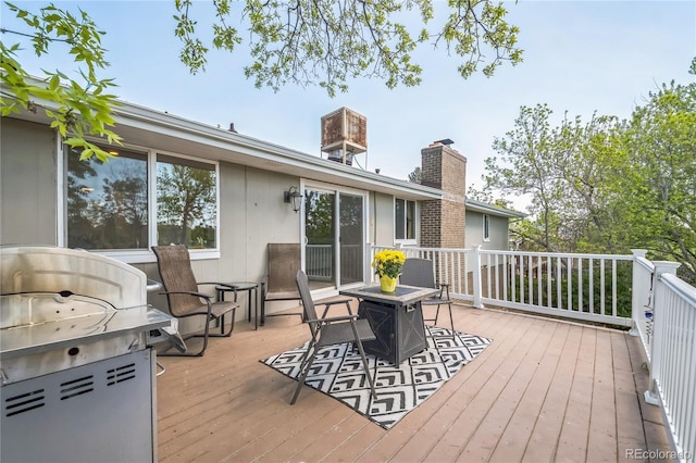 8150 W Calhoun Dr, Littleton, CO 80123 - wooden terrace with a grill