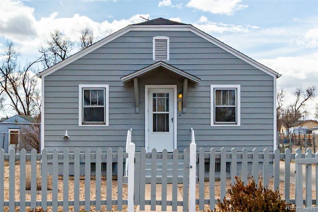 bungalow-style home featuring a fenced front yard