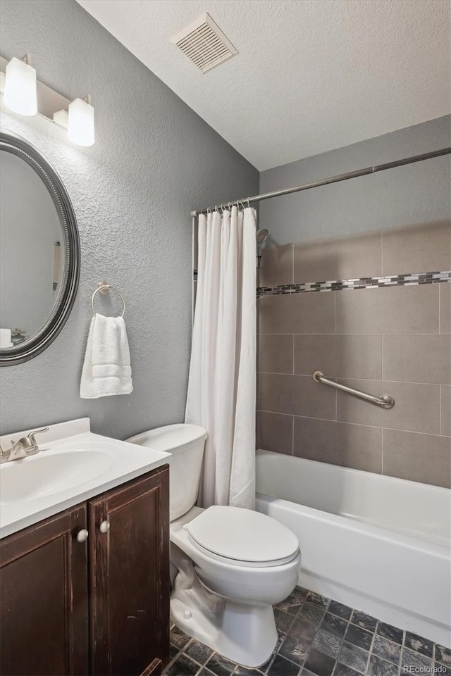 bathroom with visible vents, toilet, vanity, a textured ceiling, and shower / bathtub combination with curtain