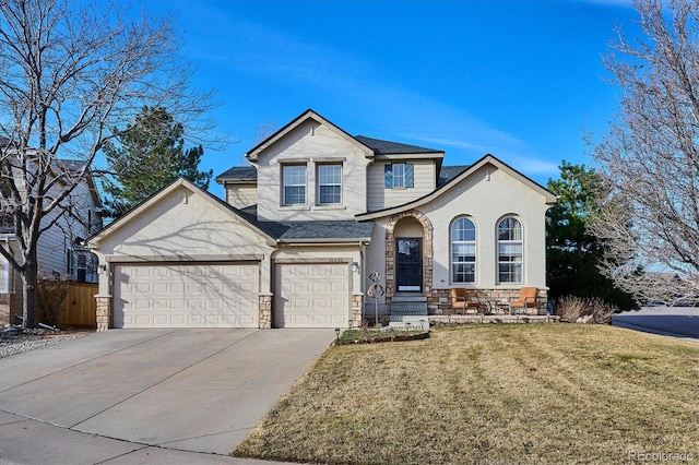 view of front of house with stone siding, a garage, concrete driveway, and a front lawn