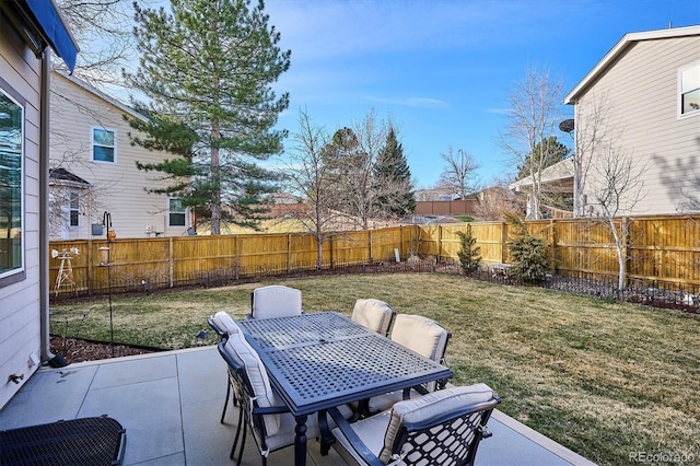 view of patio featuring outdoor dining space and a fenced backyard