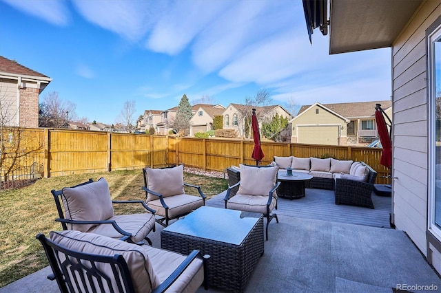 view of patio featuring a residential view, an outdoor hangout area, and a fenced backyard