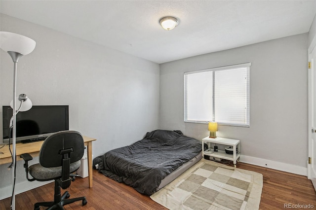 bedroom featuring hardwood / wood-style floors