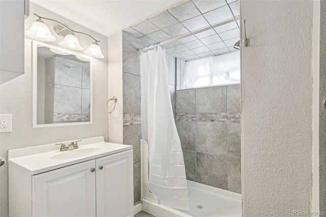 bathroom with vanity and walk in shower